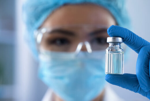 Lady Scientist Looking At Ampoule With New Medication, Vaccination Development